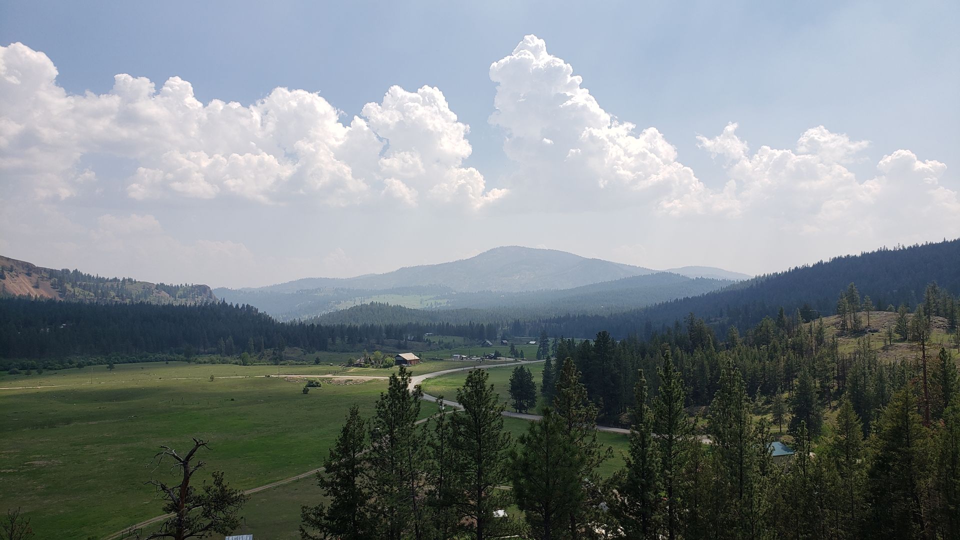 Aeneas Valley panoramic view with summer clouds over the Okanogan Highlands
