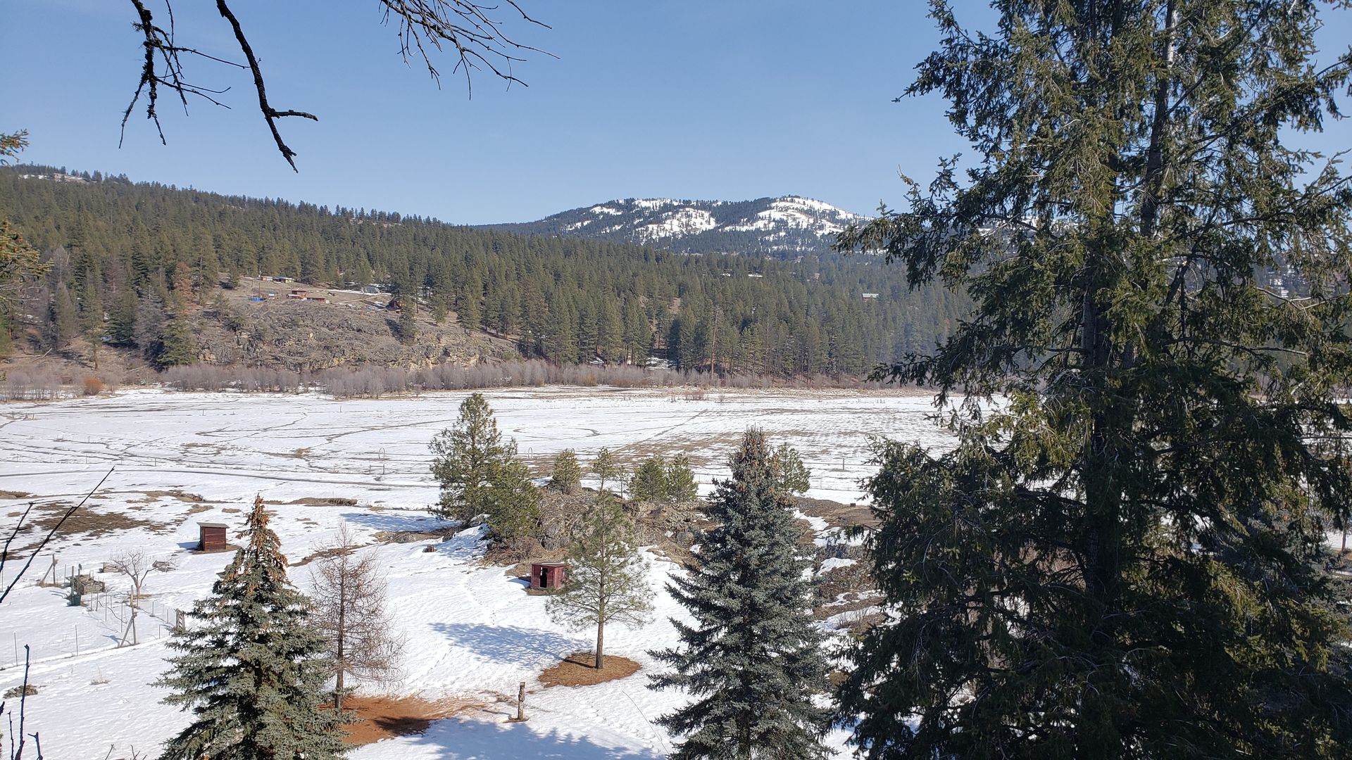 Aeneas Valley overlook in March with snow on the ground, showing winter conditions for rural homesteads